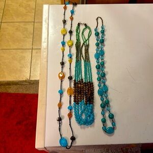 3 assorted blue necklaces for one price. Costume jewelry to match with outfits.